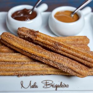 Cardamom Churros with Caramel and Rose Petal Dust